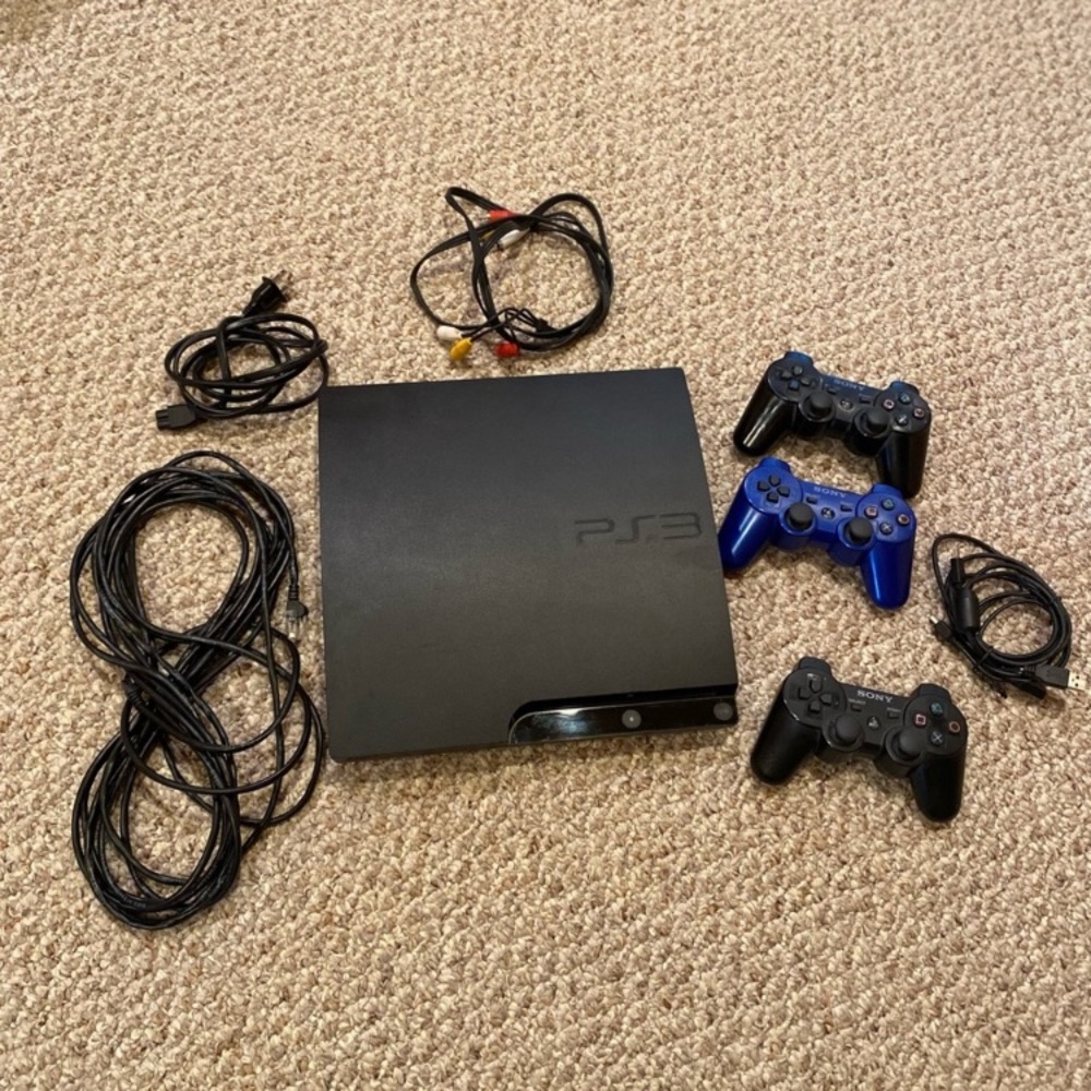 Sony PlayStation 3 Console with 3 Controllers and cords.